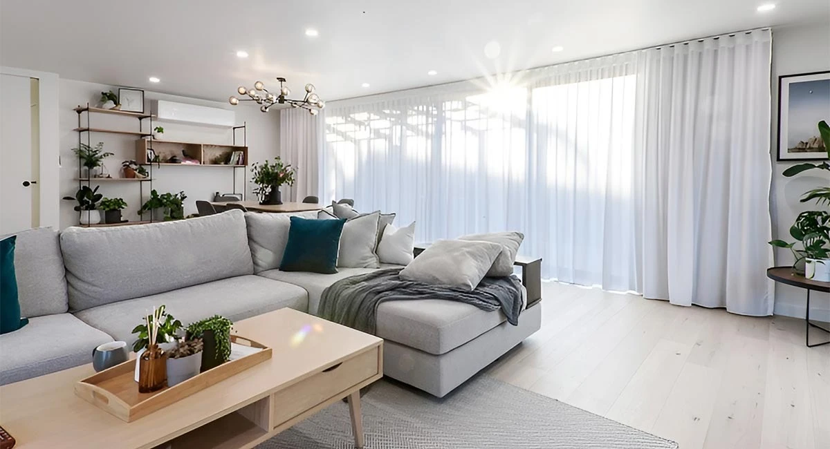 Flowing drapes or classic blinds to lift your living room