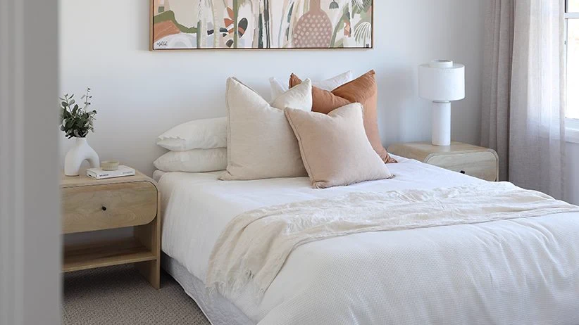 Bedroom in the Astoria 39R with a floor-length sheer curtain beside the bed