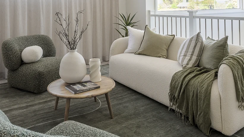 Living area with a linen-look sheer curtain behind the sofa
