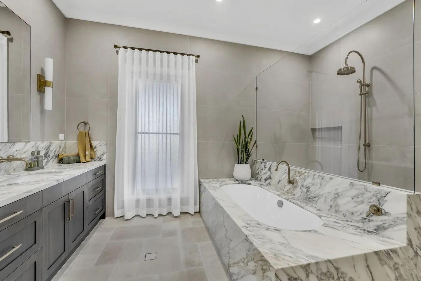 Bathroom with a marble bath and sheer curtain Bathroom with a marble bath and sheer curtain