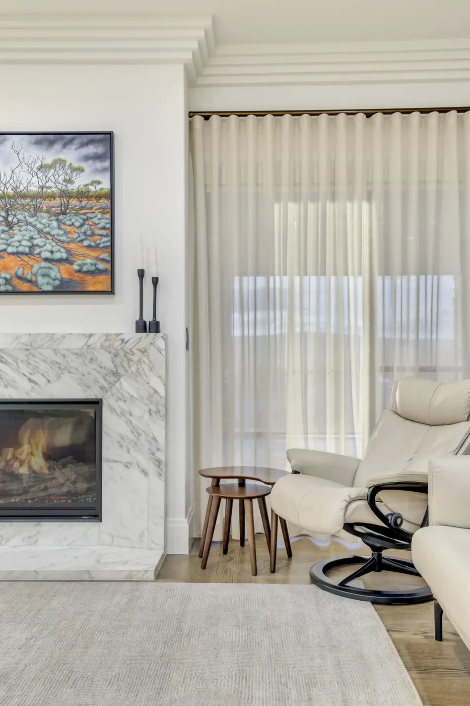Fireplace with sheer curtains beside it Fireplace with sheer curtains beside it