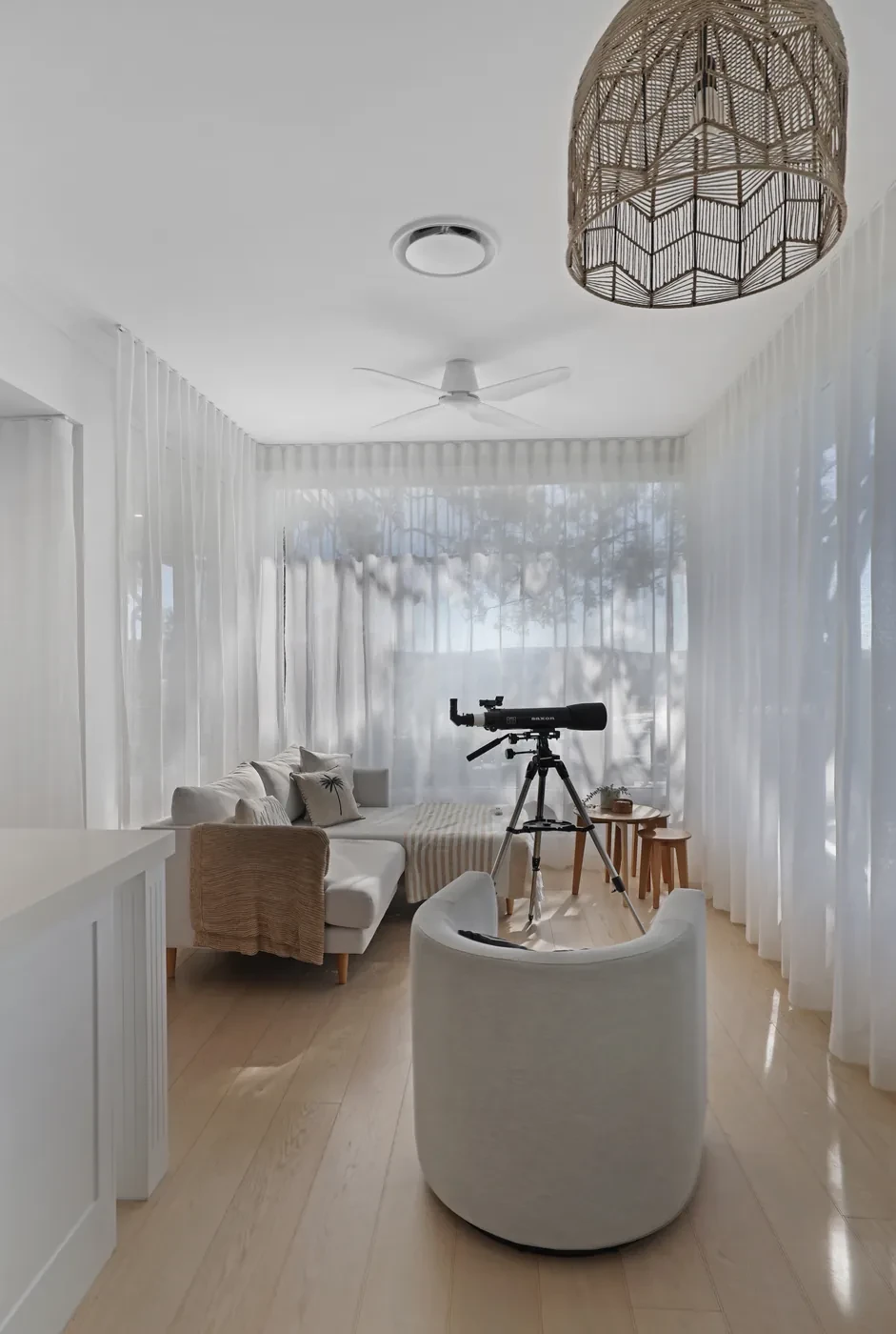Sheer curtains filtering light in a living room Sheer curtains filtering light in a living room