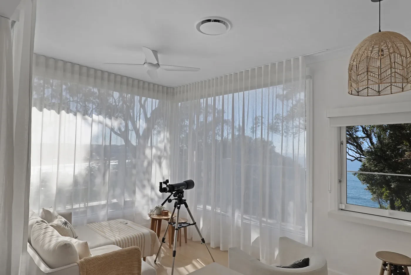 Corner windows with sheer curtains Corner windows with sheer curtains
