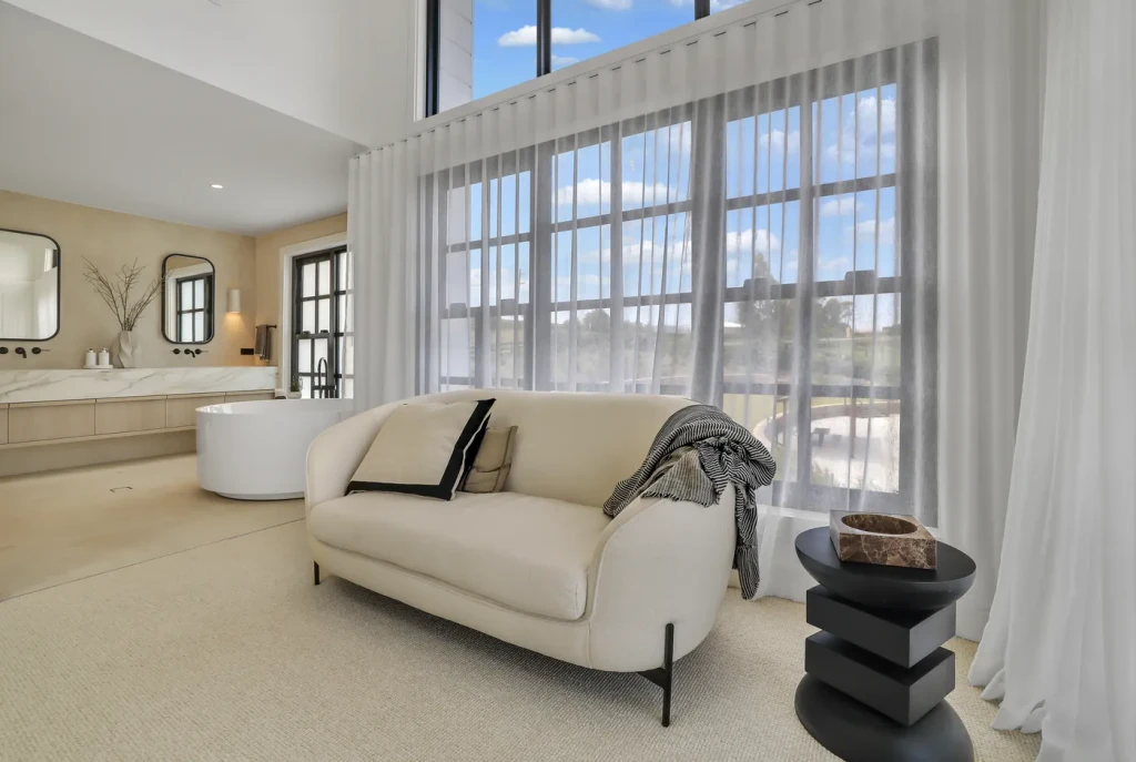 Master suite sitting area with sheer curtains Master suite sitting area with sheer curtains