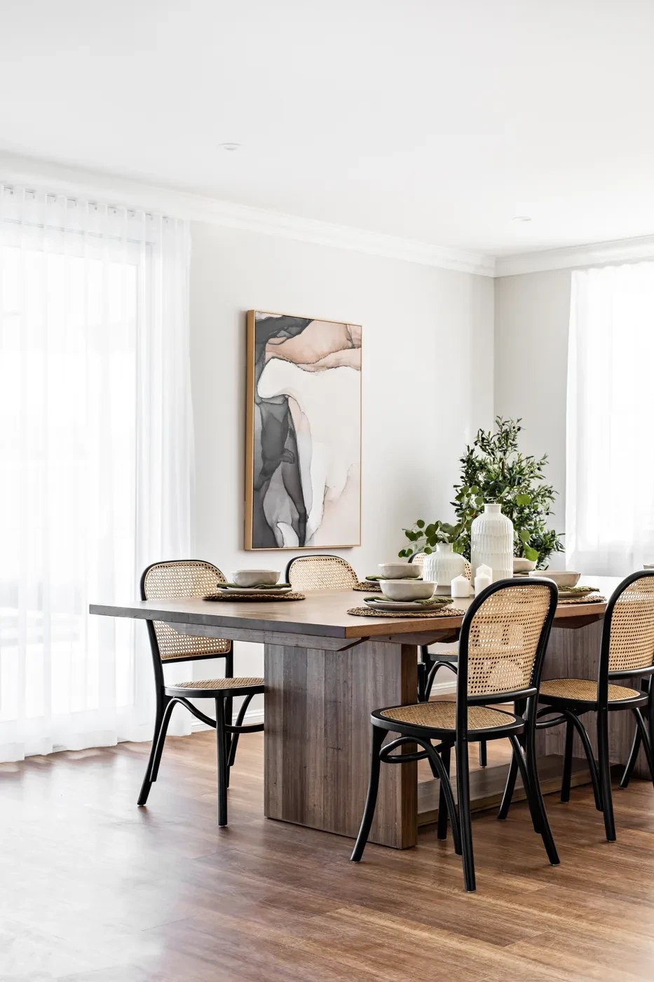Dining table with sheer curtains either side Dining table with sheer curtains either side