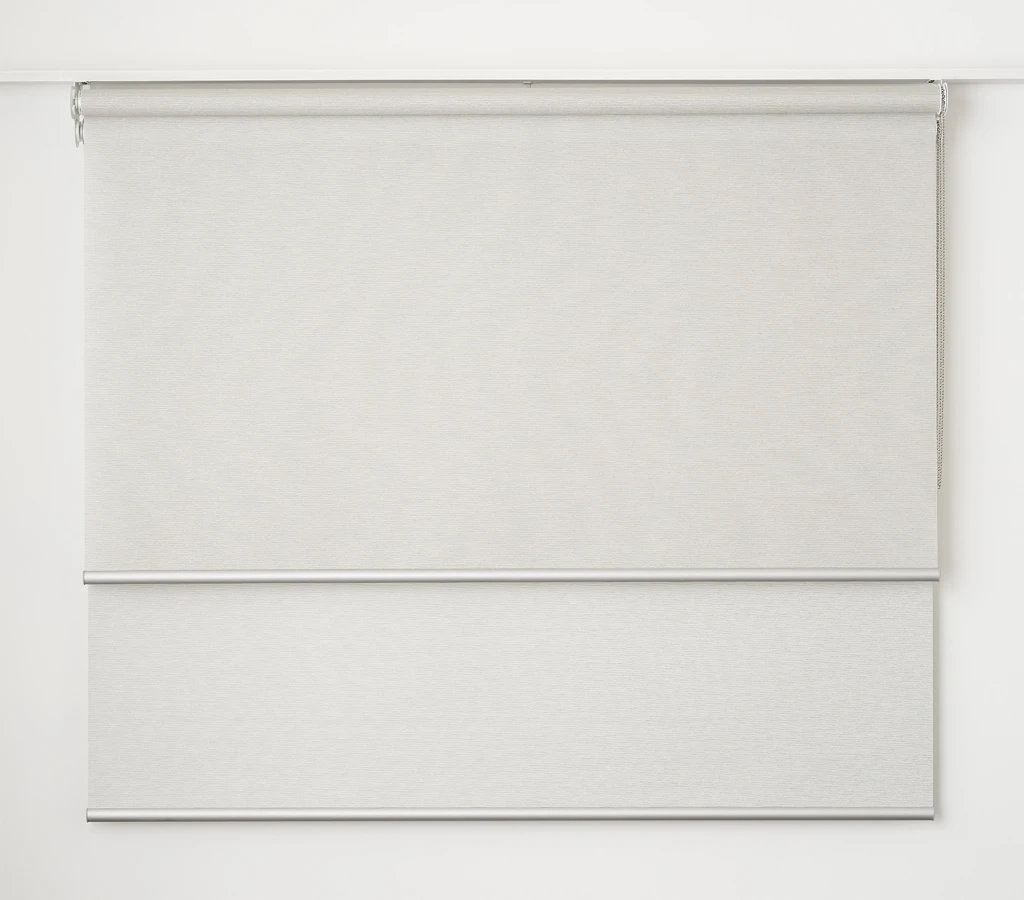 White double roller blind: the front blind part-lowered over the back blind on one bracket (studio photo)