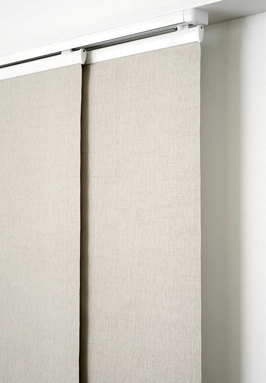 Two beige fabric panels overlapping on a white track