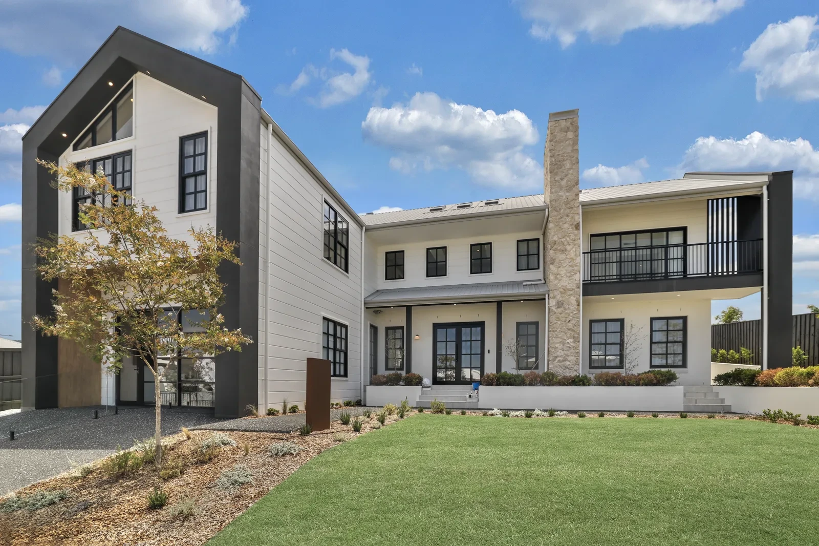 Better Built Homes Northwood 54 display home at Menangle Park: double-storey barn-style exterior with black-framed windows