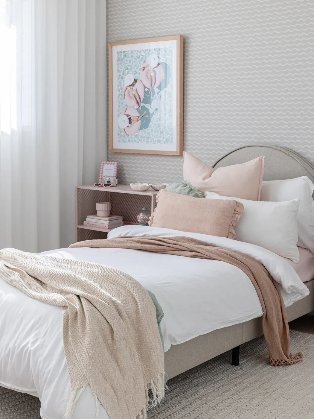 Girl's bedroom in HAAUS.7 with a white sheer curtain at the window