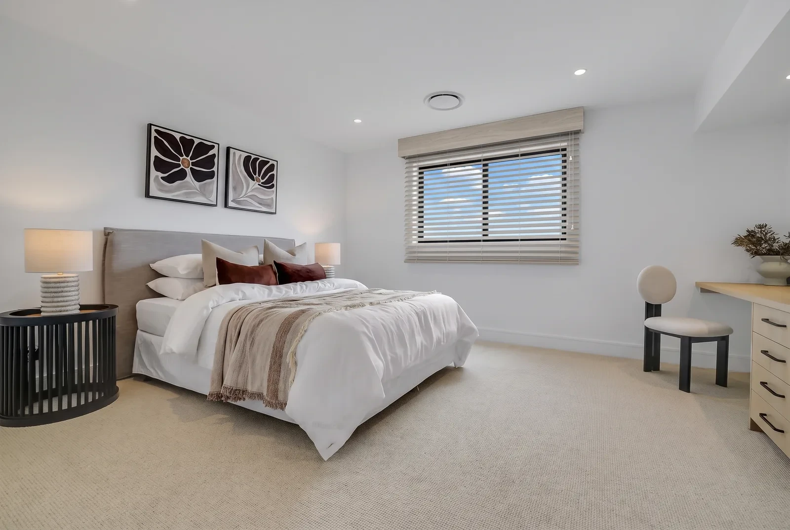 A woodgrain Visionwood venetian blind on a bedroom window