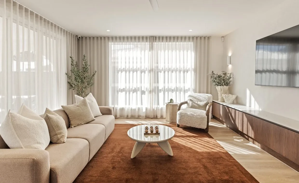 Living room in the Mariote 39 display home: S-Fold sheer curtains from the ceiling to the floor across two windows